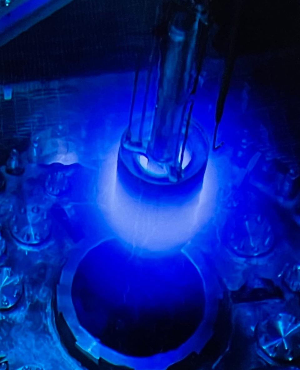 The High Flux Isotope Reactor (HFIR) core emitting Cerenkov radiation during a fuel changeout.