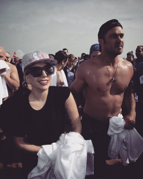 Lady Gaga, with her fiancé, Taylor Kinney, after taking the polar plunge in Chicago: “We had such a good time! Though I can tell Taylor’s shorts were freezing in this pic!” -@ladygaga