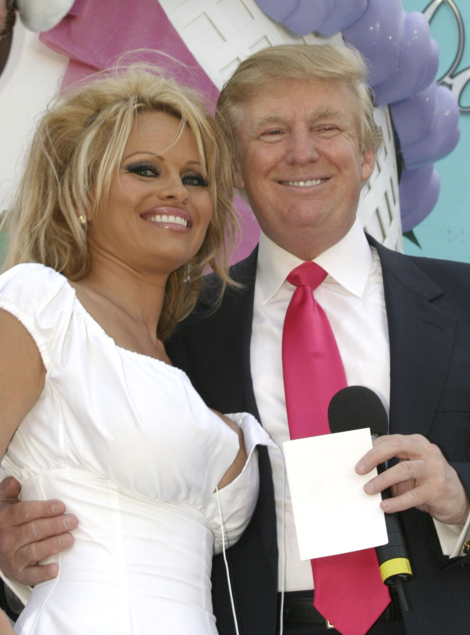 Pamela Anderson poses with Donald Trump at his birthday event at the Trump Taj Mahal in Atlantic City, N.J., June 11, 2005. (Photo: Nick Valinote/FilmMagic)