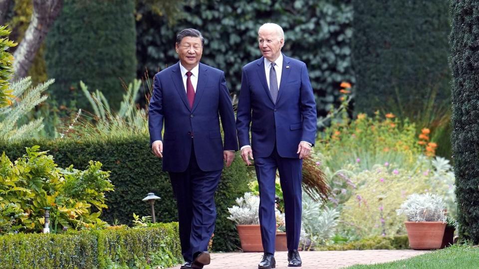 U.S. President Joe Biden, right, and Chinese President President Xi Jinping walk in the gardens at the Filoli Estate in Woodside, Calif., on Nov, 15, 2023. (Doug Mills/The New York Times via AP)
