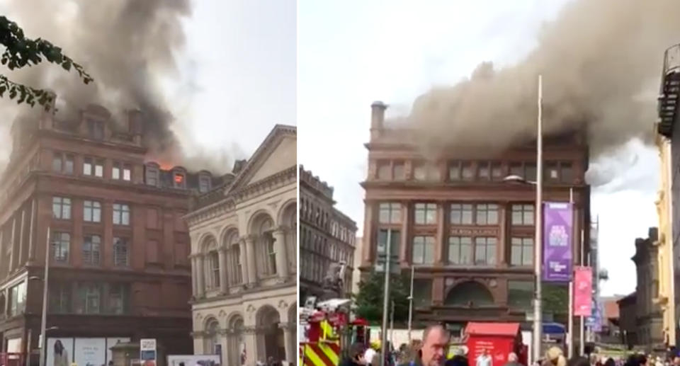 Smoke can be seen pouring from the building in the centre of Belfast