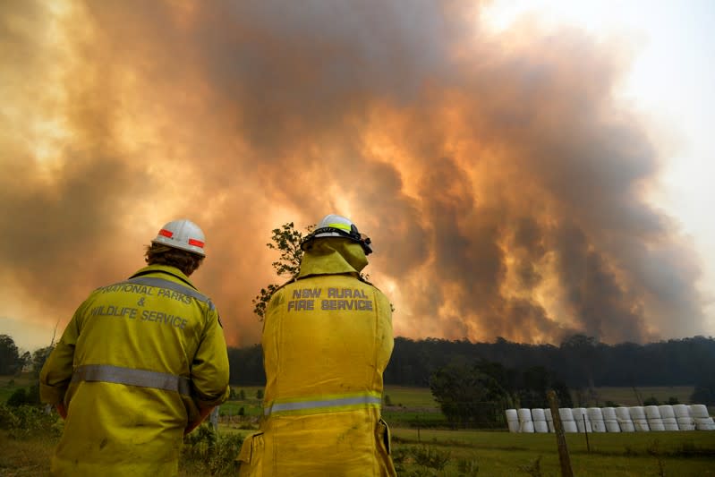 Smoke from a large bushfire is seen outside Nana Glen