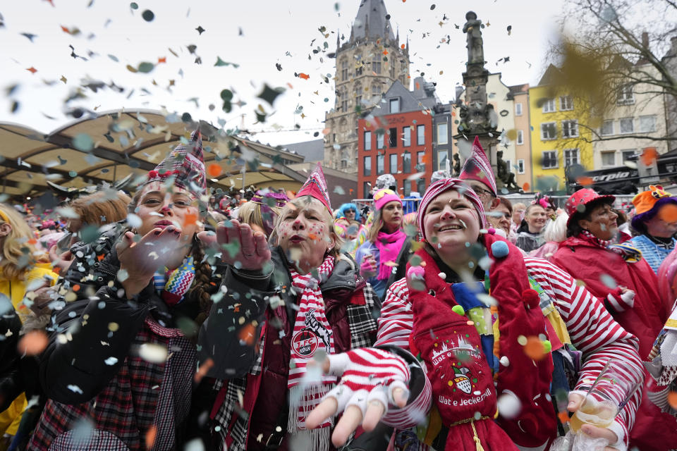 Revellers celebrate at the traditional Alter Markt the start of the street carnival in Cologne, Germany, Thursday, Feb. 8, 2024. (AP Photo/Martin Meissner)