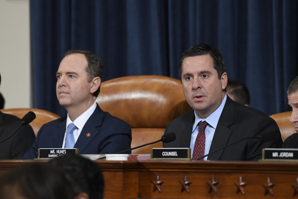 Ranking member Rep. Devin Nunes, R-Calif., right, and House Intelligence Committee Chairman Adam Schiff, D-Calif., left, give opening remarks at the start of the hearing with former U.S. Ambassador to Ukraine Marie Yovanovitch before the House Intelligence Committee on Capitol Hill in Washington, Friday, Nov. 15, 2019, in the second public impeachment hearing of President Donald Trump's efforts to tie U.S. aid for Ukraine to investigations of his political opponents. (AP Photo/Susan Walsh)