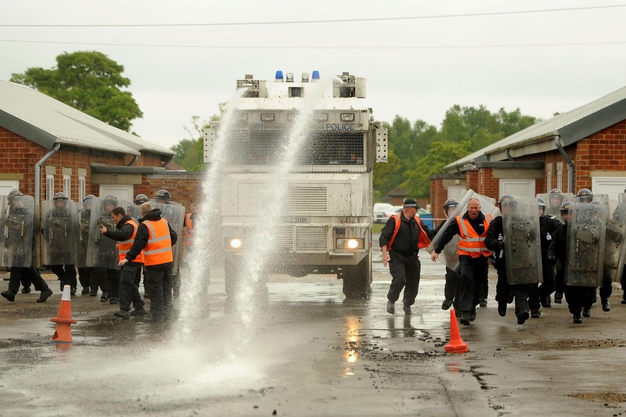 Officers training with a water cannon in 2015: PA