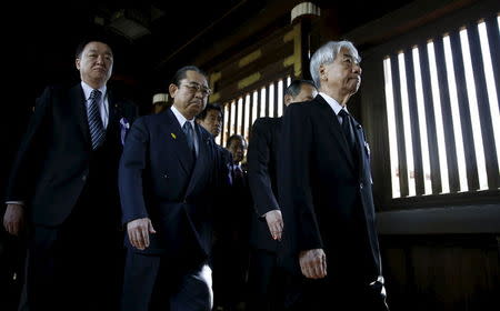 A group of lawmakers including Japan's ruling Liberal Democratic Party (LDP) lawmaker Hidehisa Otsuji (R) visit Yasukuni Shrine in Tokyo April 22, 2015. Japanese Prime Minister Shinzo Abe sent a ritual offering on Tuesday to a Tokyo shrine for war dead, irking Asian neighbors just before he hopes to meet Chinese President Xi Jinping on the sidelines of a leaders' summit in Jakarta. REUTERS/Toru Hanai