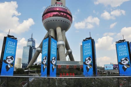 FILE PHOTO: Signs promoting the upcoming China International Import Expo (CIIE) are seen in front of the Oriental Pearl Tower at Lujiazui financial district in Pudong, Shanghai, China October 11, 2018.  REUTERS/Stringer