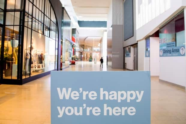 A person walks through an almost deserted Yorkdale Shopping Centre as Toronto enters the first day of a renewed coronavirus lockdown on Nov. 23, 2020.