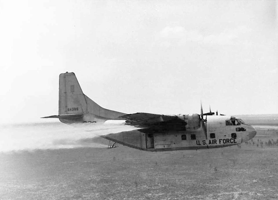 This is a C-123 testing the defoliant delivery system over Eglin Air Force Base's reservation sometime in the 1960s. Civilian contract personnel were involved in collecting data in areas where herbicides such as Agent Orange were sprayed.