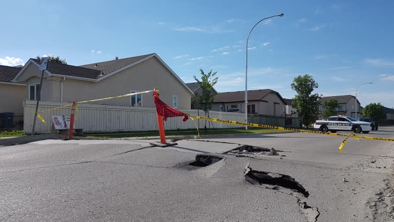 Hot weather cracks, heaves Scurfield Boulevard into dangerous 'ramp'