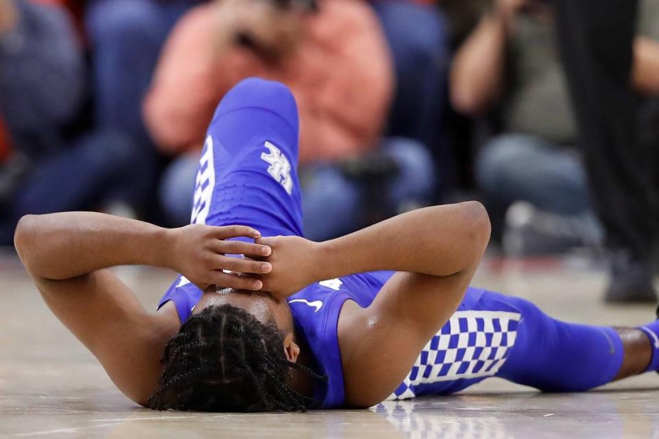 Kentucky Wildcats guard Sahvir Wheeler (2) lays on the floor after an injury during a game against the Auburn Tigers at Auburn Arena in Auburn, Ala., Saturday, Jan. 22, 2022.