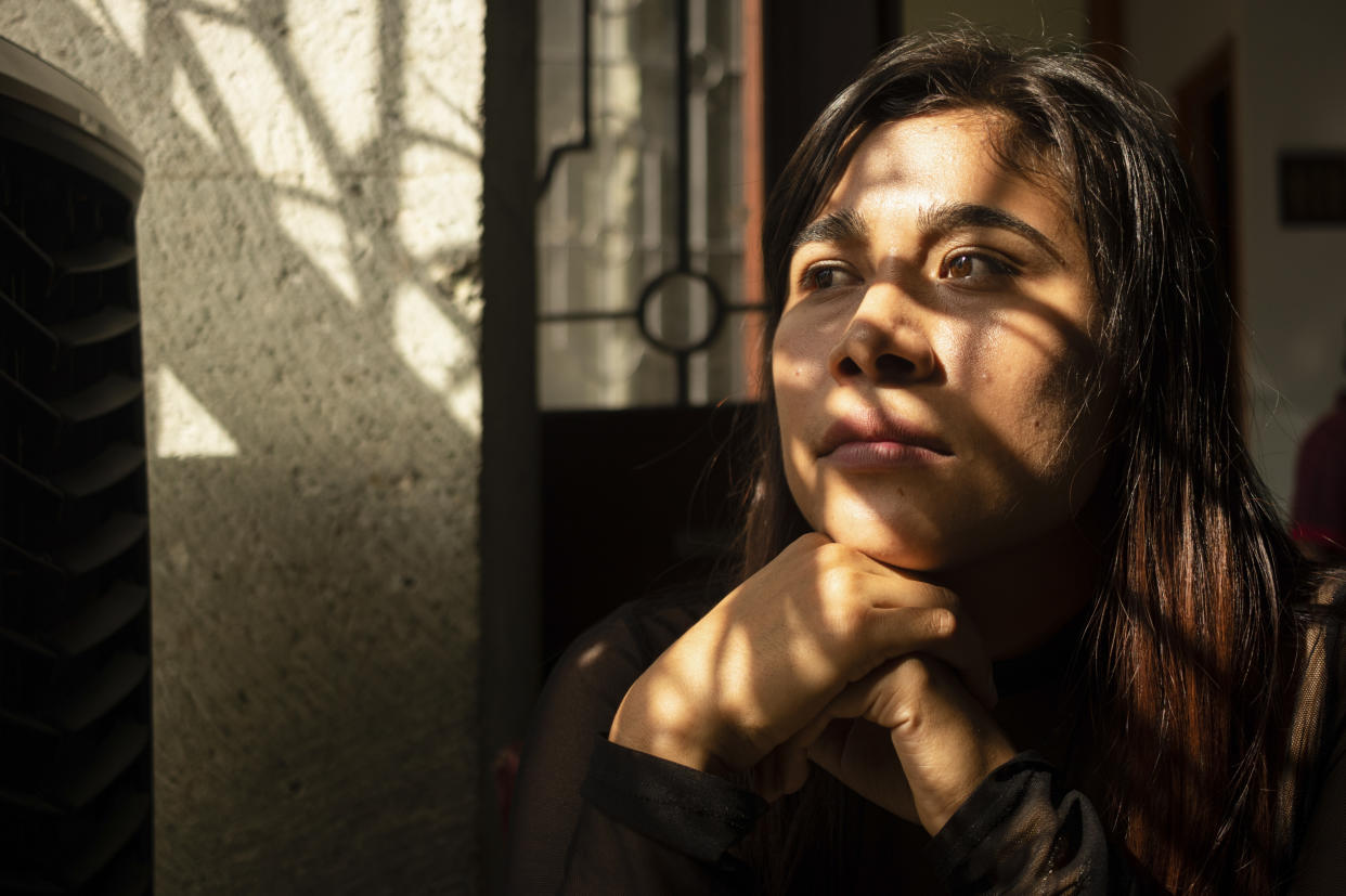 Karen Castellanos, an “acompanante,” or companion, of the Siempre Viva and Network for Sexual and Reproductive Rights, poses for a portrait in Oaxaca, Mexico, Wednesday, Oct. 12, 2022. “Our idea is not to promote abortion, but the right to decide. And if a woman tells me “I feel very good and I earn well and I want to continue a pregnancy”, we are happy that they are loving and chosen motherhoods.” Says Castellanos. (AP Photo/Maria Alferez)