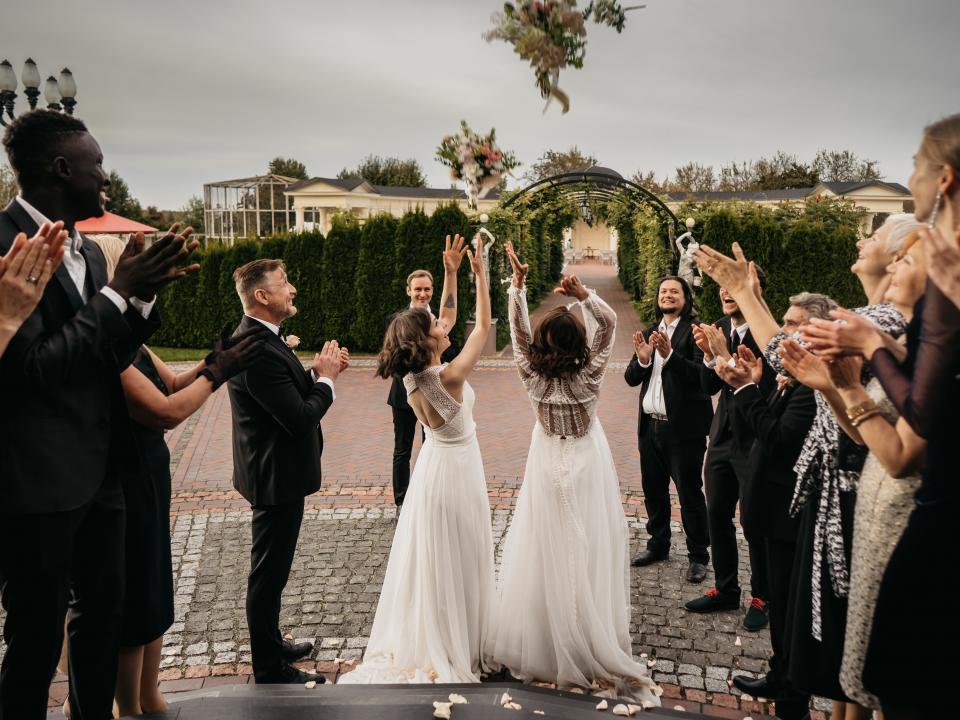 Couple tossing their bouquets.