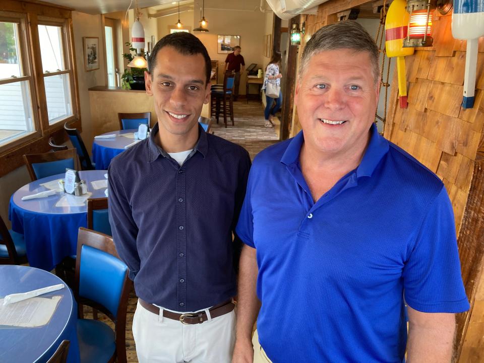 Tony Elmore, left, supervisor of Gobeille Hospitality, and Shanty on the Shore co-owner Al Gobeille stand in the dining room of the Burlington restaurant July 26, 2023.