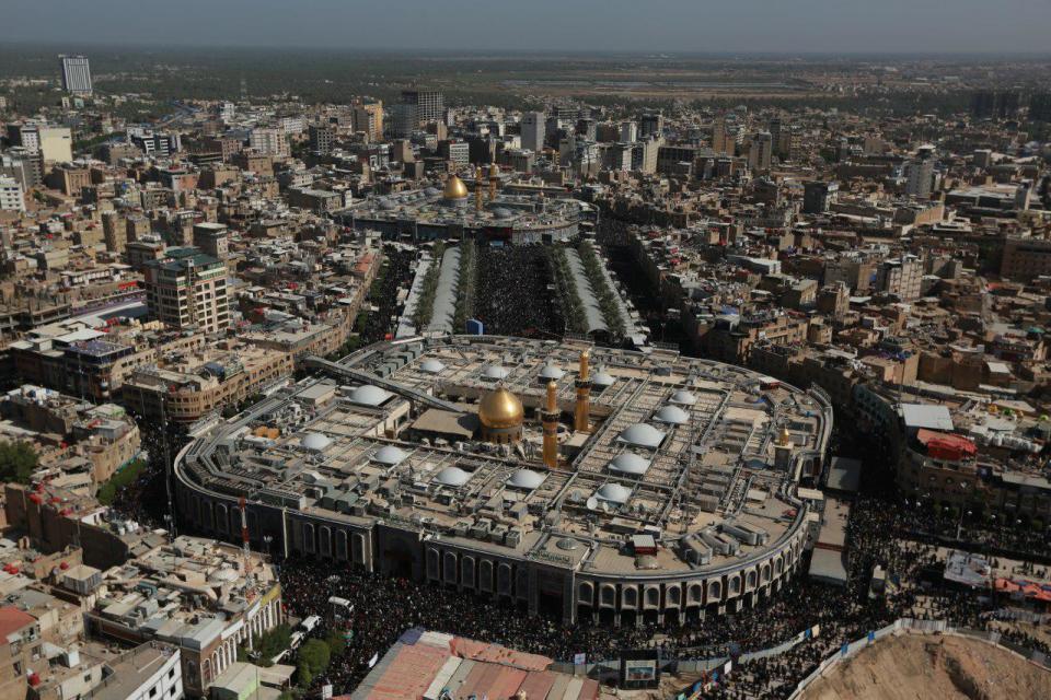 This Monday, Oct. 29, 2018, aerial photo shows Shiite pilgrims gathering between the holy shrine of Imam Hussein and the holy shrine of Imam Abbas in Karbala, Iraq. Millions of Shia Muslims from around the world are making the journey to the holy shrines of their saints Hussein and Abbas in Karbala, Iraq, in a pilgrimage that is as much about camaraderie as religion. The annual commemoration, called Arbaeen, brings more pilgrims each year than the Hajj, in Saudi Arabia, yet it is hardly known outside Islam. (AP Photo/Hadi Mizban)