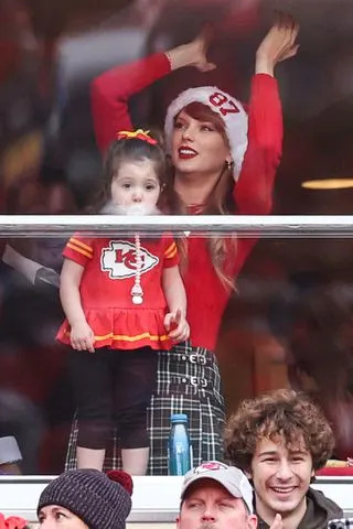 <p>Jamie Squire/Getty</p> Taylor Swift is seen in a suite prior to a game between the Las Vegas Raiders and the Kansas City Chiefs at GEHA Field at Arrowhead Stadium on December 25, 2023 in Kansas City, Missouri