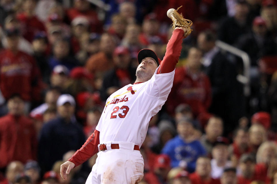 ST LOUIS, MO - OCTOBER 27: David Freese #23 of the St. Louis Cardinals drops an infield pop fly by Josh Hamilton #32 of the Texas Rangers in the fifth inning during Game Six of the MLB World Series at Busch Stadium on October 27, 2011 in St Louis, Missouri. (Photo by Jamie Squire/Getty Images)