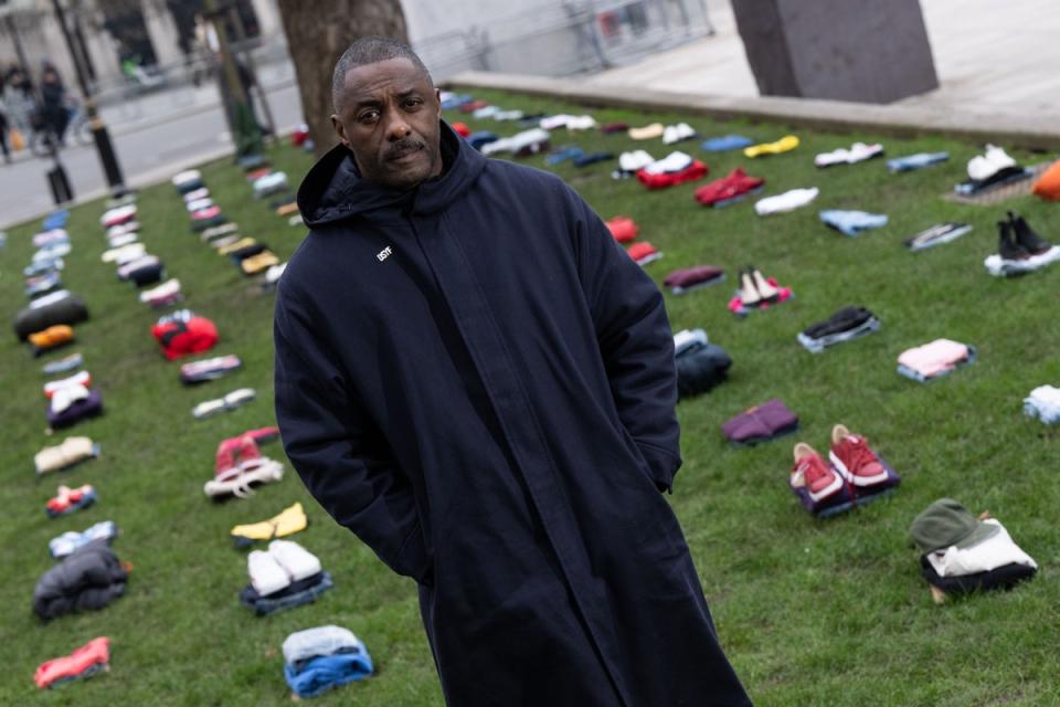 Idris Elba stood in front of an installation of over 200 bundles of clothing representing the lives lost to knife crime in the UK earlier this month (Getty Images for Don't Stop Your)
