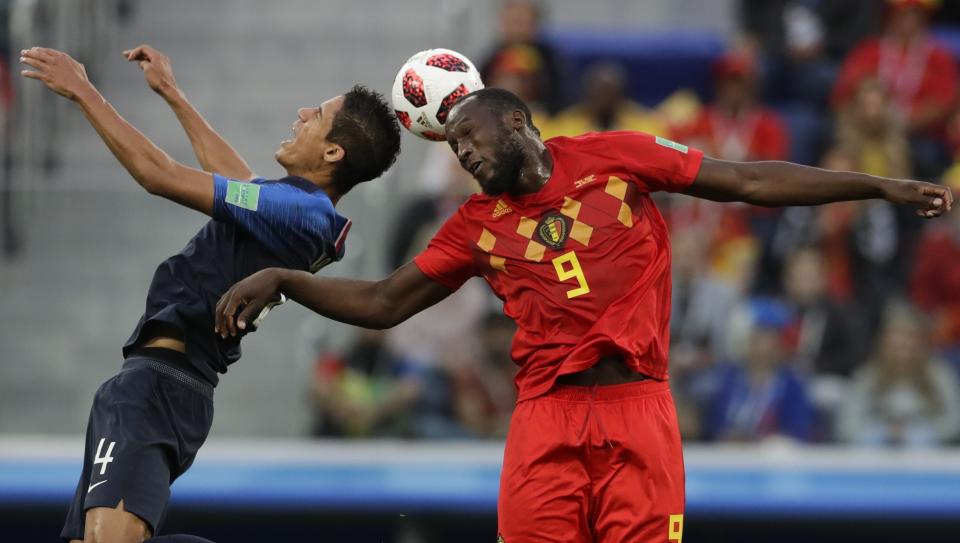 <p>France’s Raphael Varane, left, and Belgium’s Romelu Lukaku vie for the ball during the semifinal match between France and Belgium at the 2018 soccer World Cup in the St. Petersburg Stadium, in St. Petersburg, Russia, Tuesday, July 10, 2018. (AP Photo/Petr David Josek) </p>