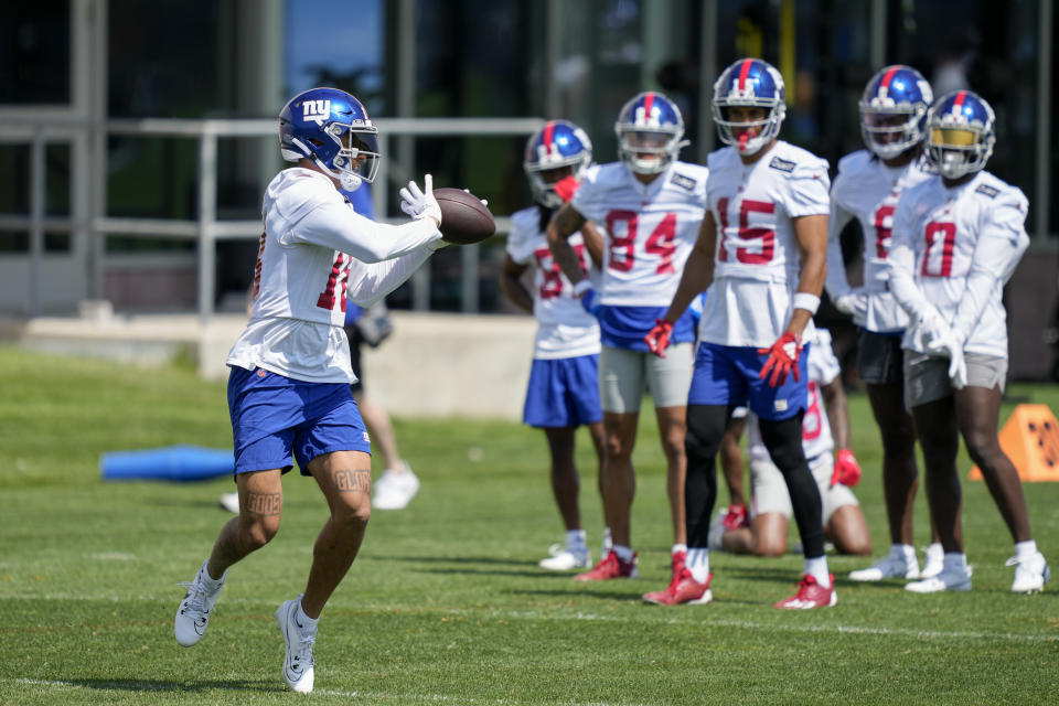 New York Giants wide receiver Collin Johnson (left) is one of several young wideouts fighting for a roster spot on the team this season. (AP Photo/John Minchillo)