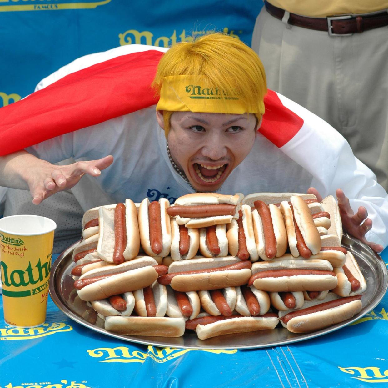 <span>Takeru Kobayashi after winning the Nathan’s hotdog contest in 2006.</span><span>Photograph: Bobby Bank/WireImage</span>