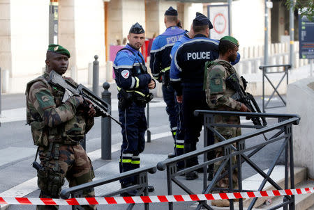 French police and soldier secure a street near the Saint-Charles train station after French soldiers shot and killed a man who stabbed two women to death at the main train station in Marseille, France, October 1, 2017. REUTERS/Jean-Paul Pelissier