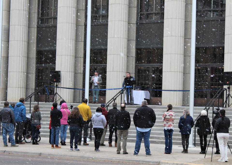 A small gathering of public supporters brave the cold to celebrate a rededication of the Great Falls Civic Center on Friday