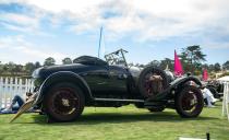 <p>This year, Pebble Beach was chockablock with Bentleys from the '20s and '30s in a nod to the brand's centenary. These old-school Bentleys tend to be big, truckish, dark-green-painted things. This 1925 model is a little more distinct. Its red radiator badge indicates it was the Speed model (one of only 513), meaning it has a high-compression engine and a close-ratio gearbox. Its two-seat Park Ward bodywork also distinguishes it, and it has perhaps the world's silliest and most charming hood ornament. If you're expecting a sleek bird or a shapely lady for this car's ornament, forget it. A potbellied Punch character stands atop the radiator holding a wrench and a crankshaft.<em>–Daniel Pund</em></p>