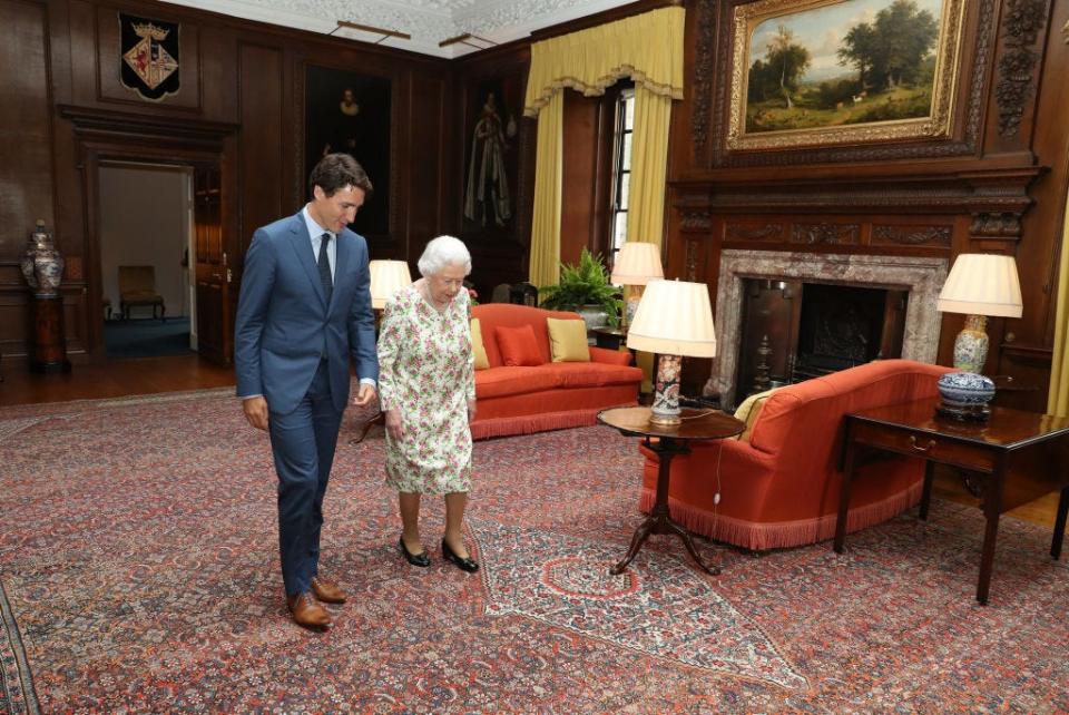 Queen Elizabeth II greets Canadian Prime Minister Justin Trudeau at the Palace of Holyroodhouse in 2018.