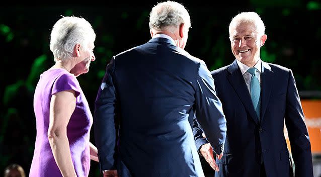 Prime Minister Malcolm Turnbull greets Prince Charles on the podium. Source: Getty