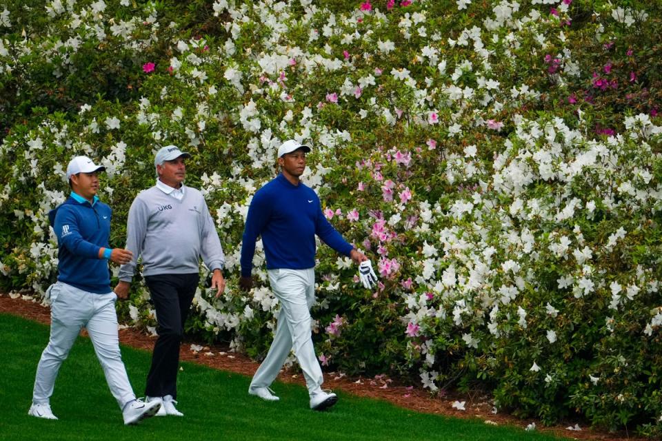 Tom Kim, Fred Couples (centre) and Tiger Woods walk on the 13th fairway during practice for the Masters (Matt Slocum/PA) (AP)