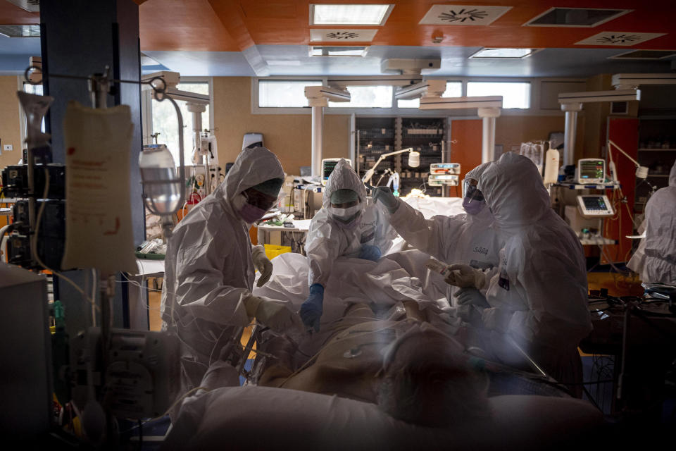 Image: Doctors treat COVID-19 patients in an intensive care unit at the third Covid 3 Hospital (Istituto clinico CasalPalocco) during the Coronavirus emergency on March 26, 2020, in Rome, Italy. (Antonio Masiello / Getty Images)