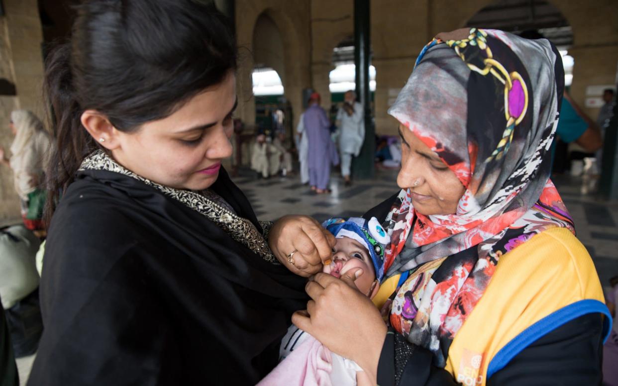 A child being vaccinated for polio in Pakistan - Insiya Syed