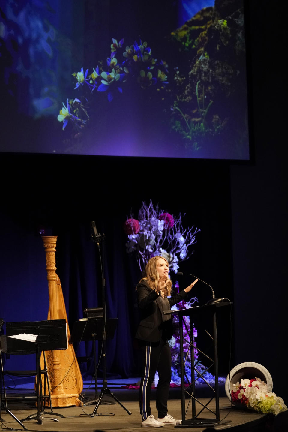 Crystal Woodman-Miller, who was a student at Columbine High School at the time of the massacre, speaks during a faith-based memorial service for the victims of the killing spree at the school nearly 20 years earlier, at a community church, Thursday, April 18, 2019, in Littleton, Colo. (Rick Wilking/Pool Photo via AP)