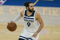 Minnesota Timberwolves guard Ricky Rubio (9) dribbles the ball up the court against the Golden State Warriors during the first half of an NBA basketball game in San Francisco, Monday, Jan. 25, 2021. (AP Photo/Jeff Chiu)