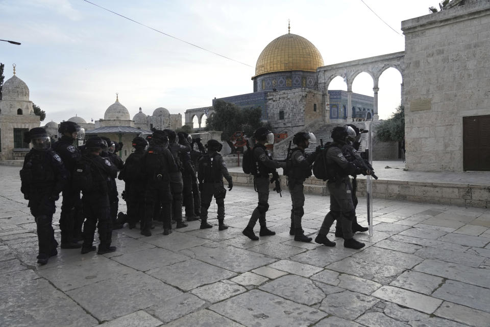 Israeli police deploy in the Al Aqsa Mosque compound in Jerusalem's Old City, Friday, April 22, 2022. Israeli police and Palestinian youths clashed again at the major Jerusalem holy site sacred to Jews and Muslims on Friday despite a temporary halt to Jewish visits to the site, which are seen as a provocation by the Palestinians. (AP Photo/Mahmoud Illean)