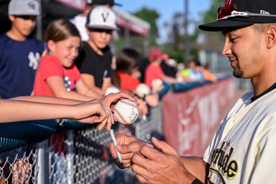 Visalia Rawhide's Jordan Lawlar signs autographs before their game against Rancho Cucamonga Quakes on Friday, April 8 on Opening Night at Valley Strong Stadium.