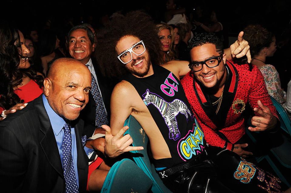 the three Gordy men sitting together at an event