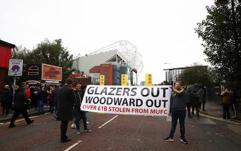 Protestors outside Old Trafford - Credit: Getty Images