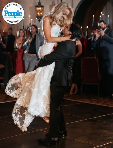 <p>DeAngelo Castro for SYMBOLL</p> Nita Strauss and Josh Villalta dance at their wedding reception