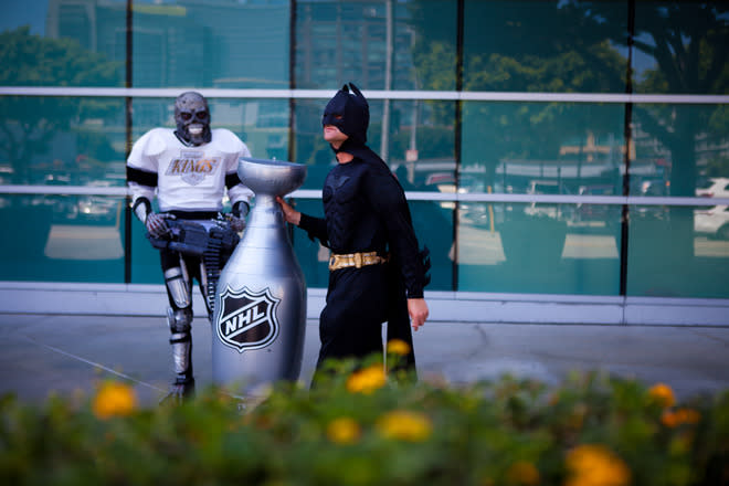 LOS ANGELES, CA - JUNE 11: Two Los Angeles Kings fans arrive at the Staples Center before the start of Game 6 of the 2012 Stanley Cup Final June 11, 2012 in Los Angeles, California. A win in Game 6 against the New Jersey Devils would lead the Los Angeles Kings to their first championship in franchise history. (Photo by Jonathan Gibby/Getty Images)