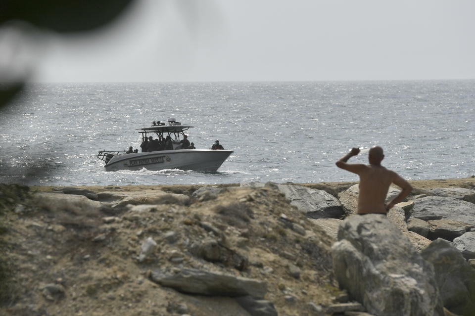 Security forces patrol near the shore in the port city of La Guaira, Venezuela, Sunday, May 3, 2020. Interior Minister Nestor Reverol said on state television that security forces overcame before dawn Sunday an armed maritime incursion with speedboats from neighboring Colombia in which several attackers were killed and others detained. (AP Photo/Matias Delacroix)