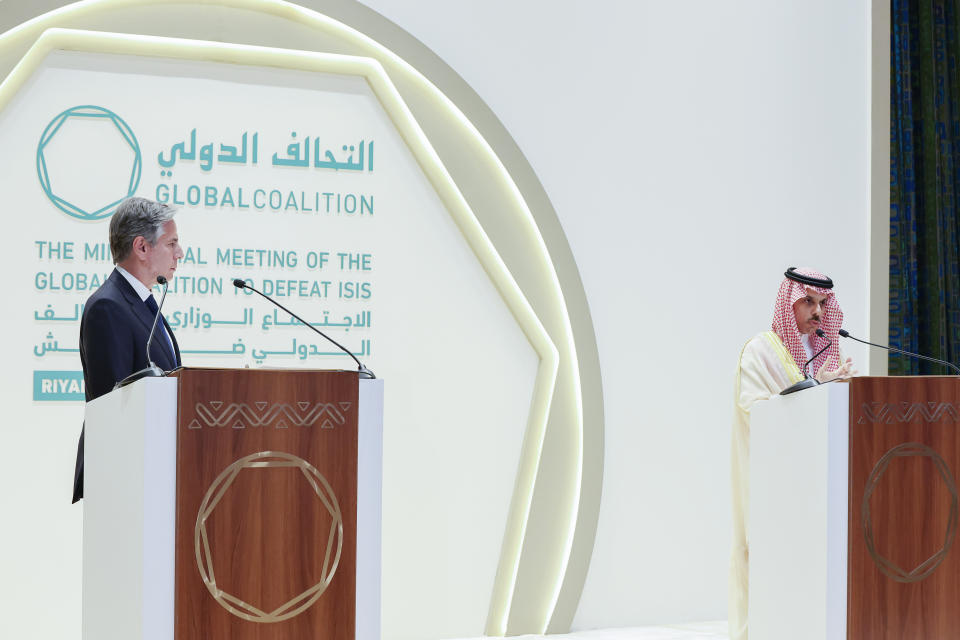 Secretary of State Antony Blinken, left, listens during a joint news conference with Saudi Arabia's Foreign Minister Prince Faisal bin Farhan at the Intercontinental Hotel in Riyadh, Saudi Arabia, Thursday, June 8, 2023. (Ahmed Yosri/Pool Photo via AP)