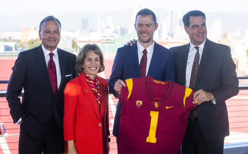 LOS ANGELES, CA - November 29 2021: From left Rick Caruso, USC President Carol L. Folt, new USC head football coach.