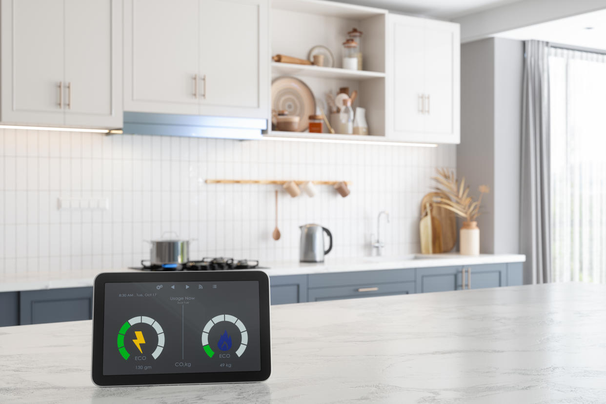 Smart Meter On Empty Marble Surface With Blurred Kitchen Background