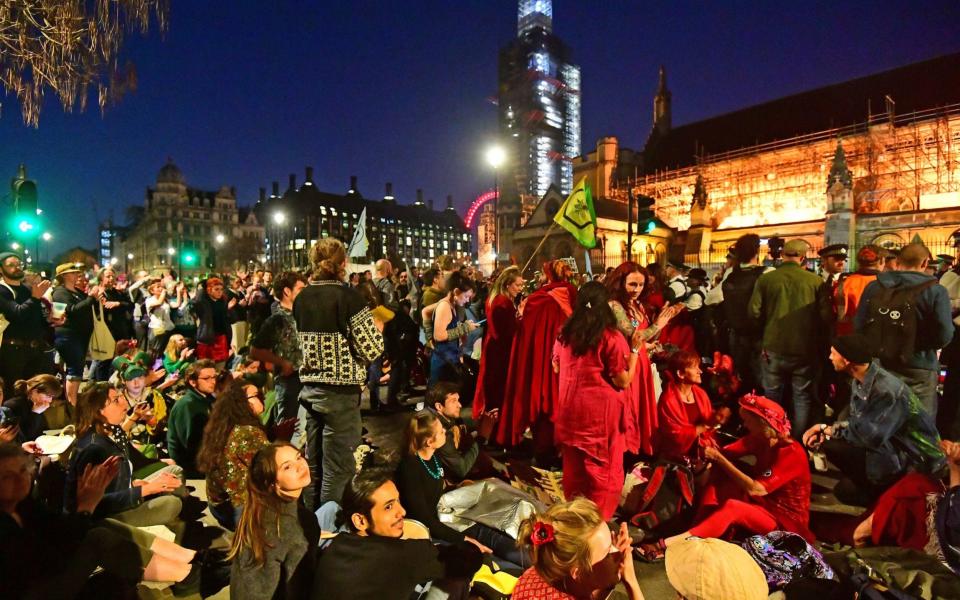 Demonstrators in Parliament Square as night fell on Saturday - PA