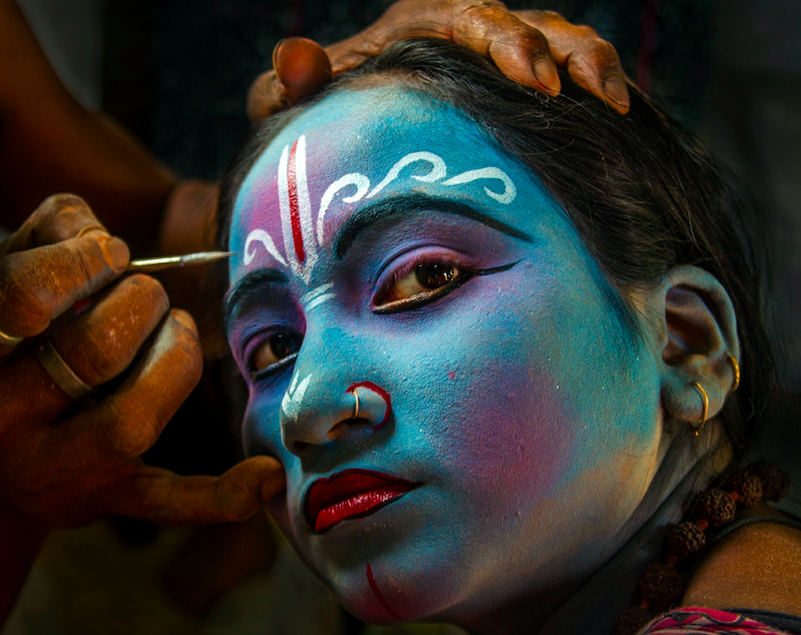 During the holy season of Charak, little girls like to dress as Lord Krishna, the most famous romantic male character of Indian mythology.