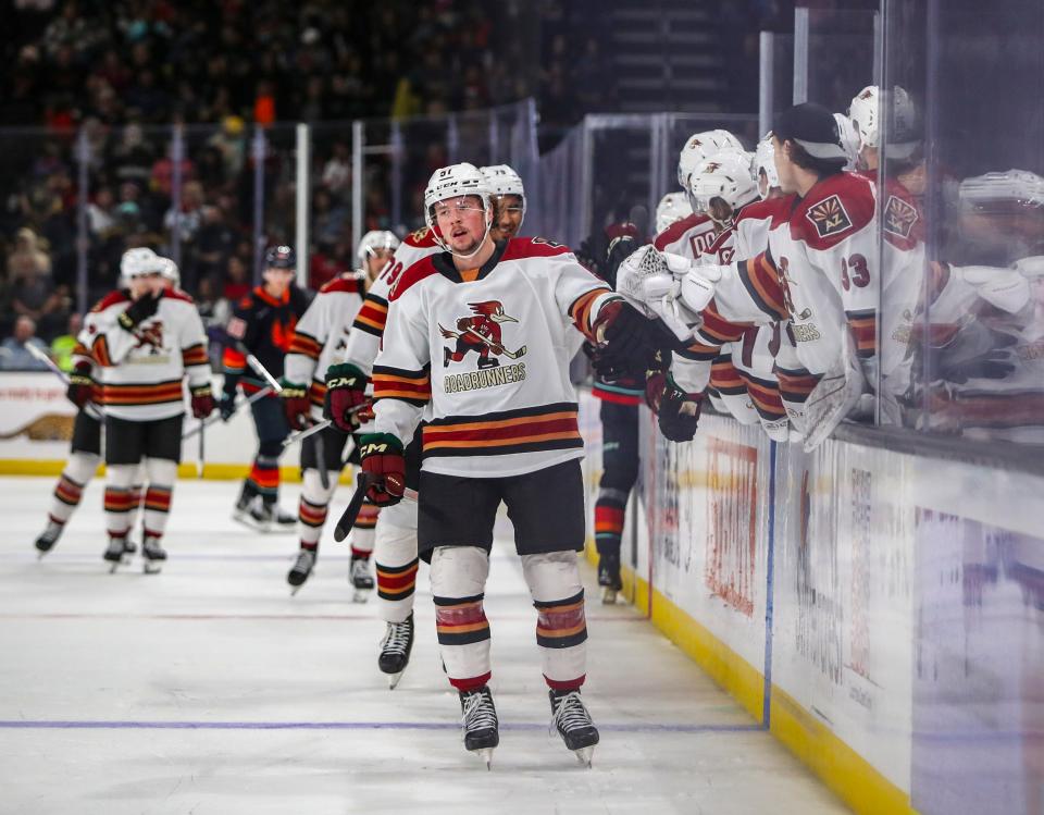 Tucson forward Reece Vitelli (51) celebrates a goal giving the Roadrunners a 3-1 lead during the third period of their game at Acrisure Arena in Palm Desert, Calif., Wednesday, April 17, 2024.