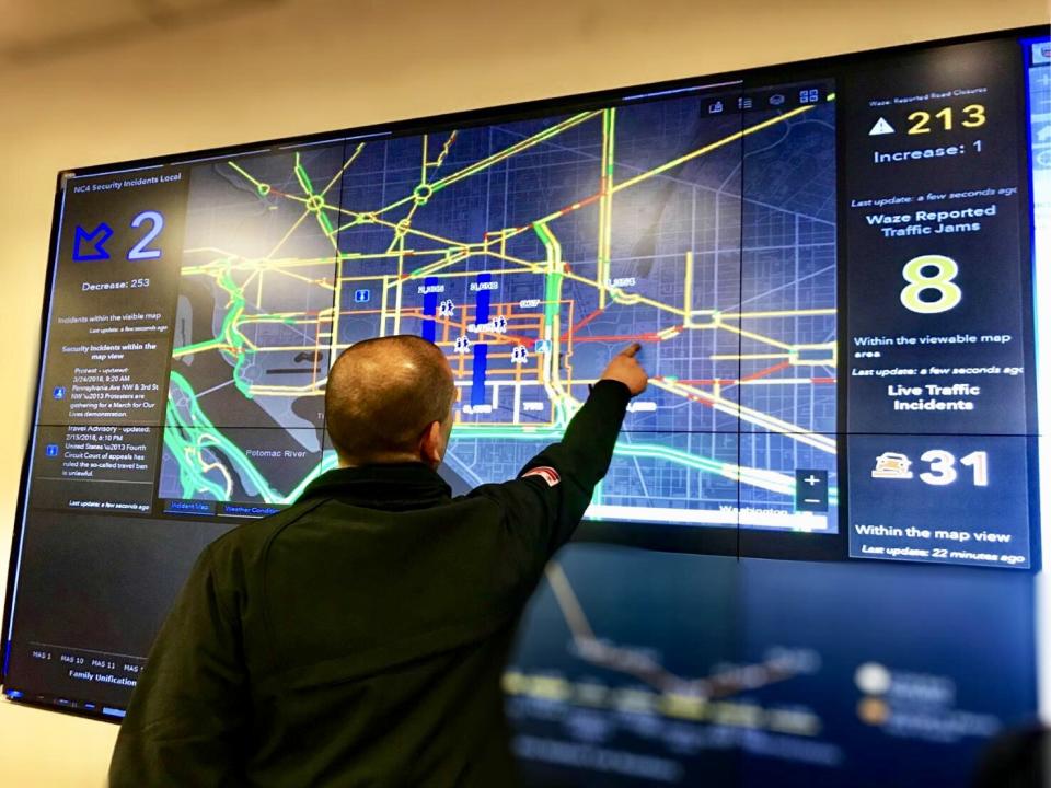 Chris Rodriguez, director of the D.C. Homeland Security and Emergency Management Agency, points to real-time traffic updates and other data being broadcast at the agency’s command center ahead of the March for Our Lives rally in Washington, D.C. on March 24, 2018. (Photo: Caitlin Dickson/Yahoo News)