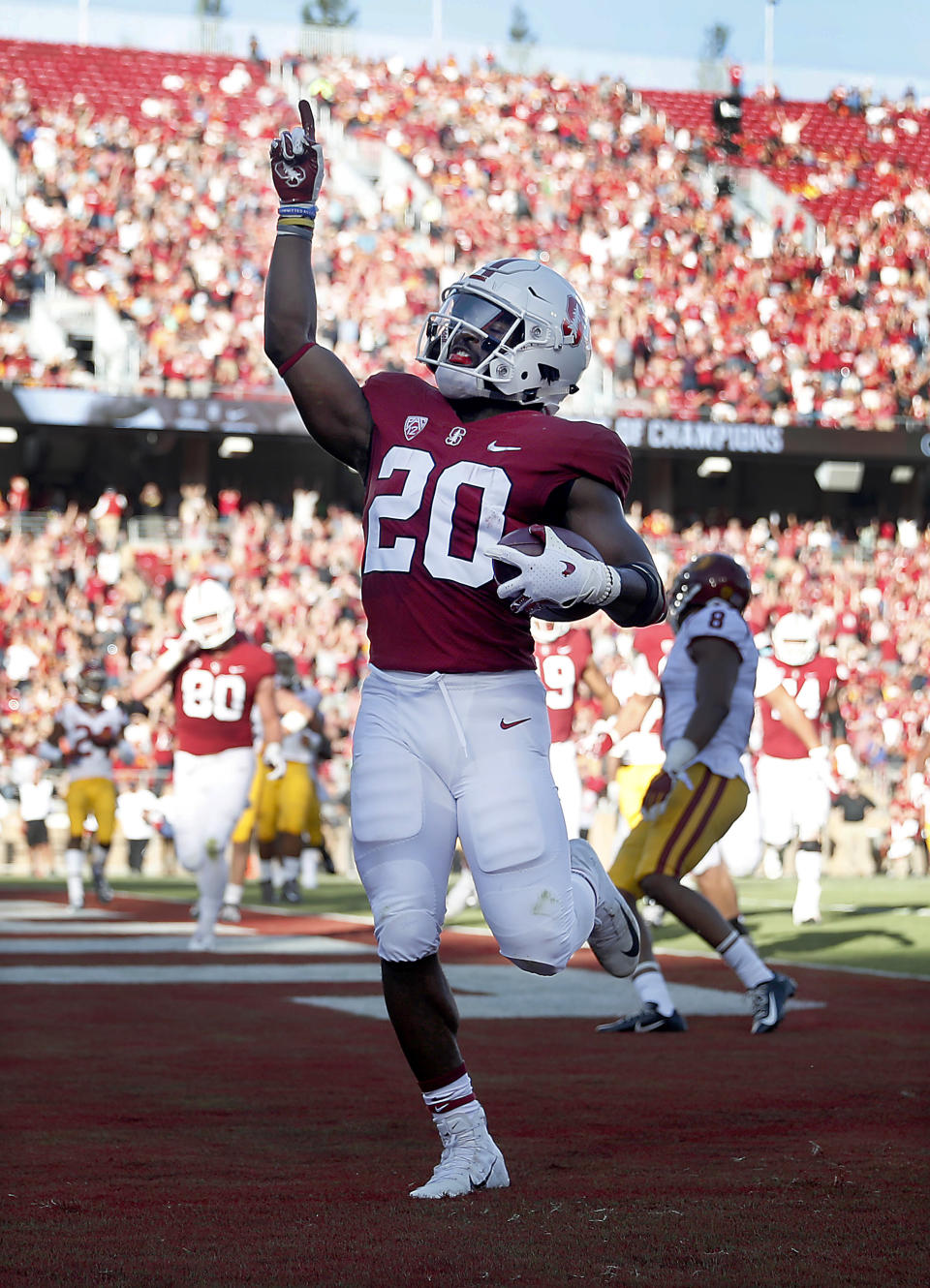 Stanford Cardinal running back Bryce Love (20) celebrates after scoring a touchdown against Southern California during the first half of an NCAA college football game, Saturday, Sept. 8, 2018, in Stanford, Calif. (AP Photo/Tony Avelar)